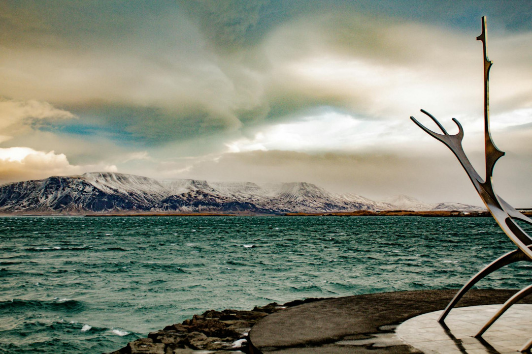 body of water near mountain